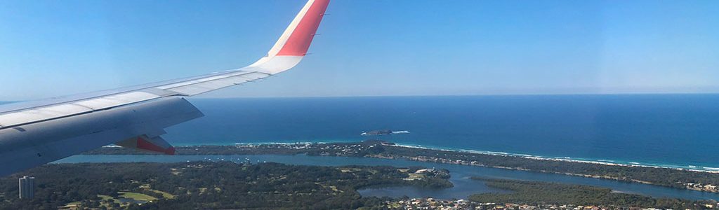 View from passenger plane window behind wing